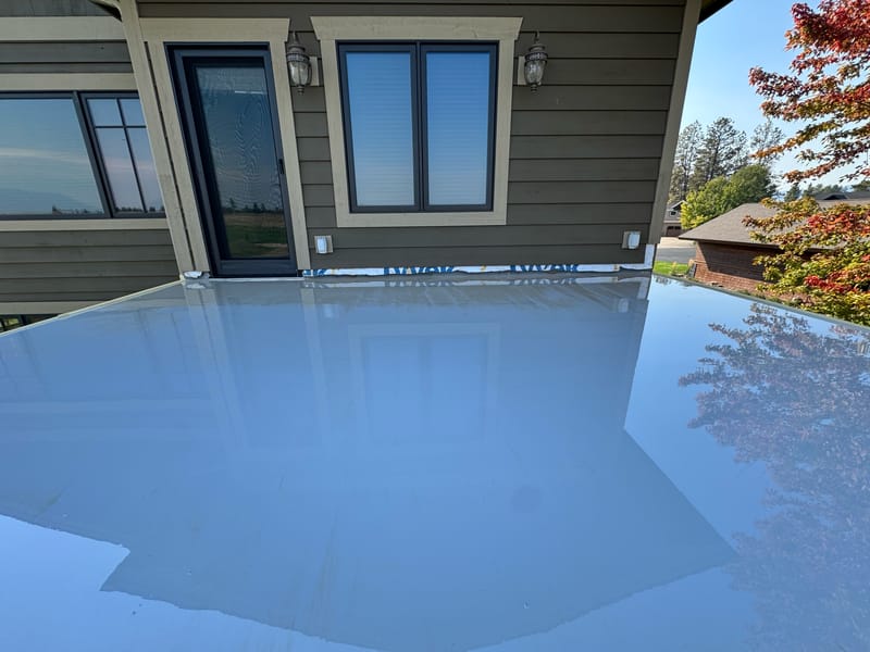 Wet fluid-applied waterproofing membrane over the prepared deck substrate.