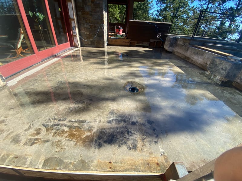 Moisture-barrier primer applied over the existing concrete deck slab.