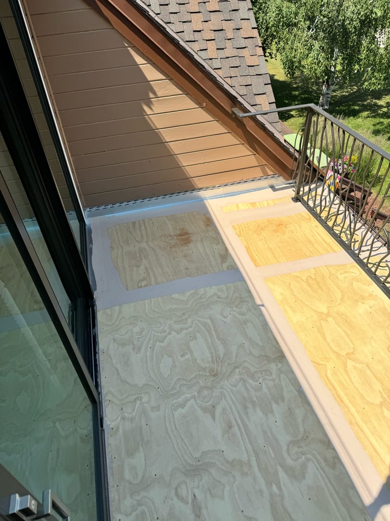 Balcony plywood seams reinforced with embedded fabric detail coat.