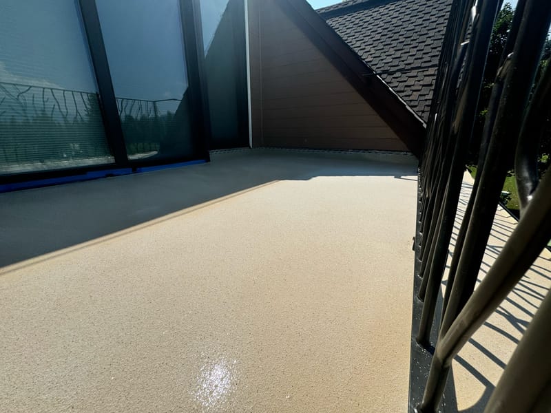 Finished textured waterproof balcony surface on a Whitefish home.